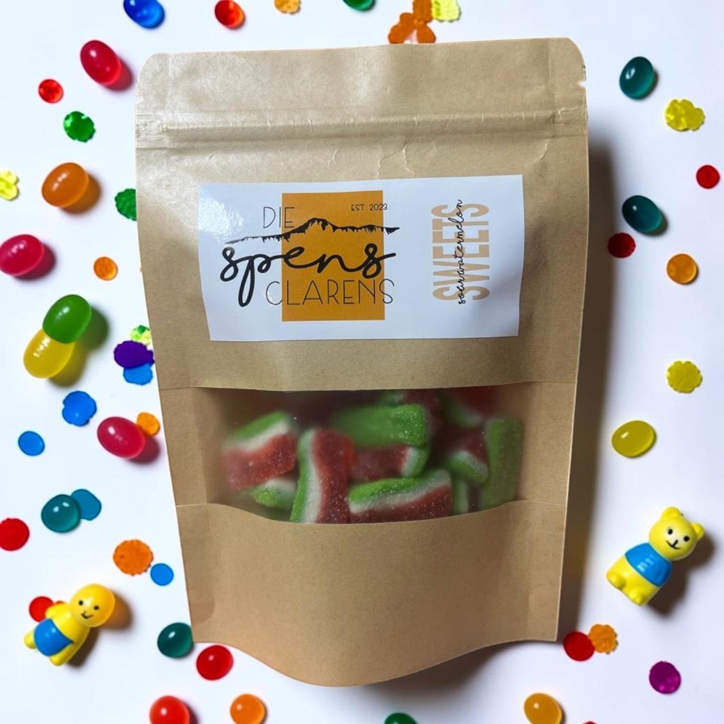 Die Spens Clarens sour watermelon gummies shaped like watermelon slices, with a chewy texture and vibrant taste.