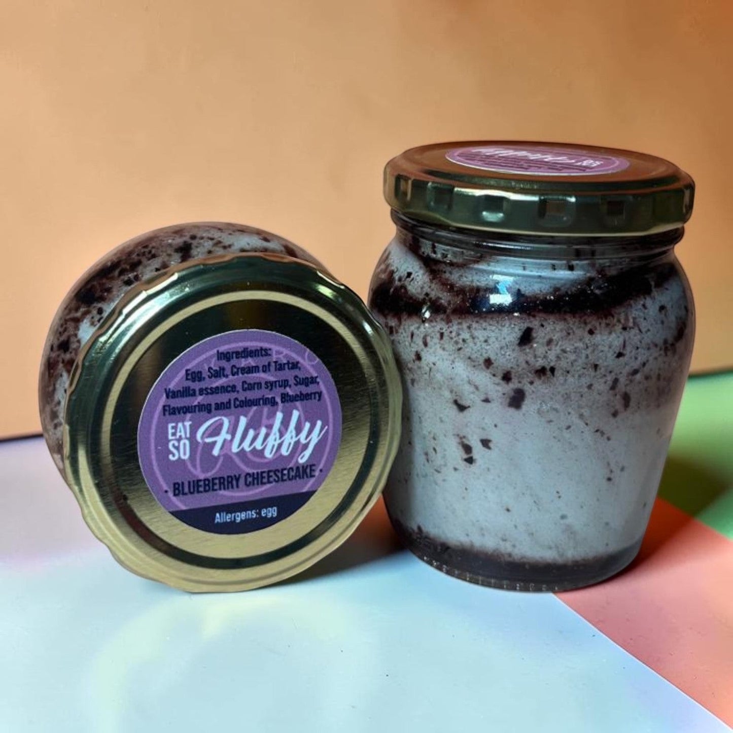 Die Spens Clarens Blueberry Cheesecake Fluffy dessert in a jar with blueberry swirls and a light, airy texture.