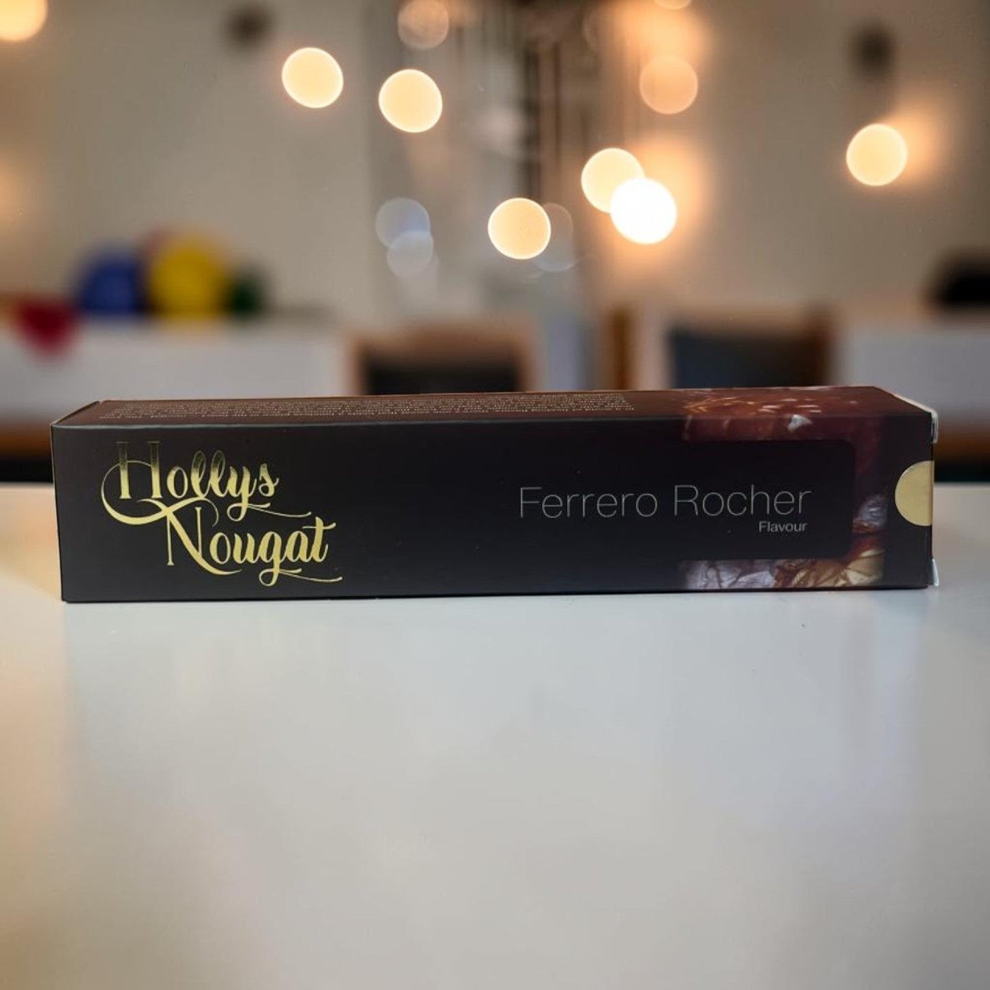 Die Spens Clarens Holly's Nougat Ferrero Rocher flavour box, featuring gold lettering and a rich chocolate image.