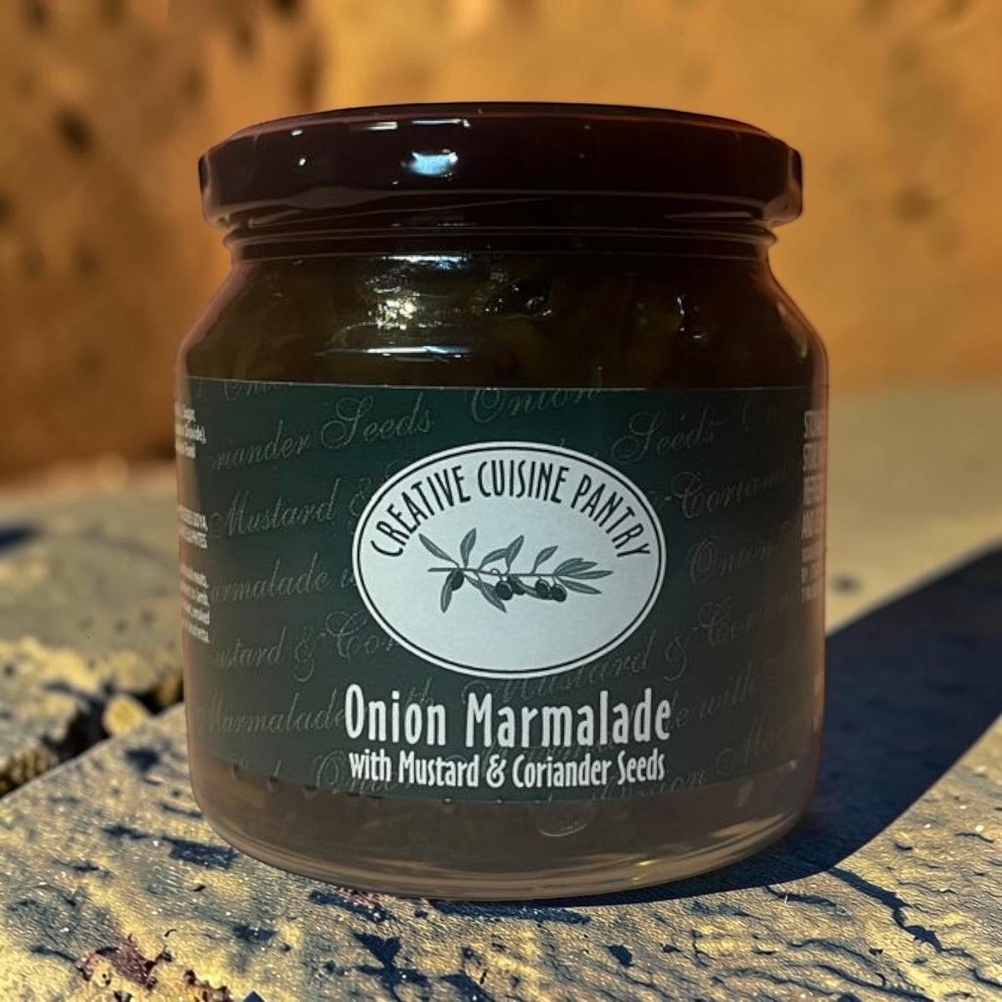 Die Spens Clarens Onion Marmalade with Mustard & Coriander Seeds in a glass jar, perfect for glazes and cheese boards.