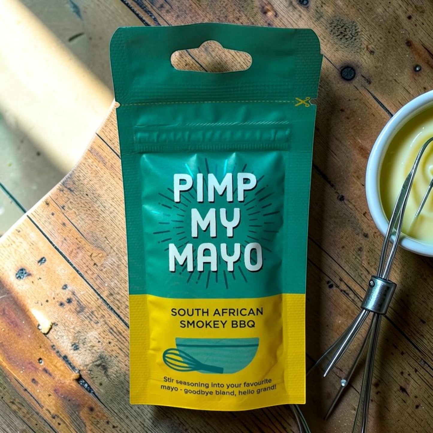 Die Spens Clarens Pimp My Mayo South African Smokey BBQ seasoning blend packet with whisk and bowl of mayonnaise.