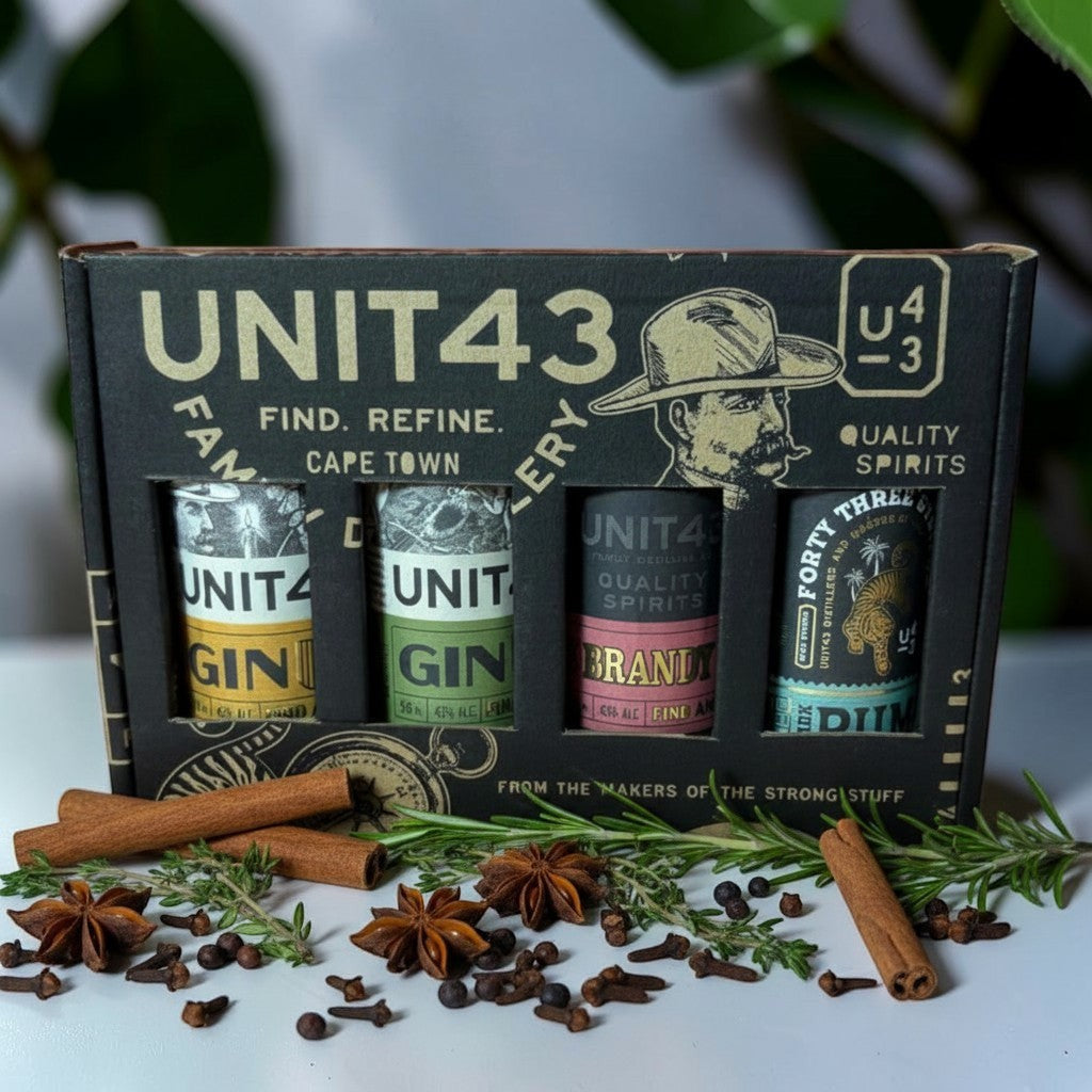 Die Spens Clarens Unit 43 Mixed Mini Box featuring 4 spirit bottles: Original Gin, Oak Wooded Gin, Brandy, and Rum, presented in a custom gift box with spices.