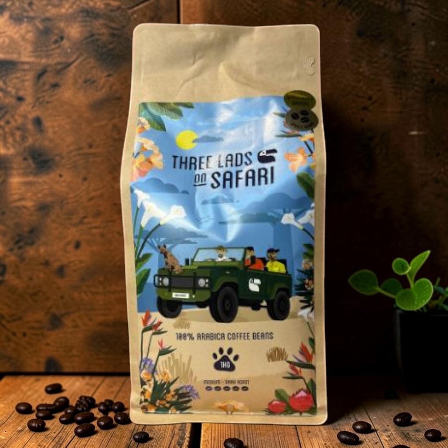 Die Spens Clarens Three Lads on Safari Wild Dog coffee beans bag with safari illustration and loose beans.