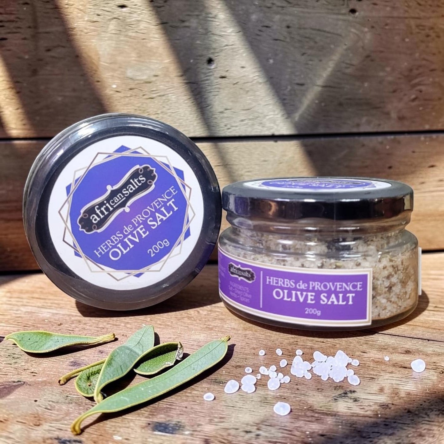 Die Spens Clarens African Salts Herbs de Provence Olive Salt in a glass jar with a black lid, 200g.