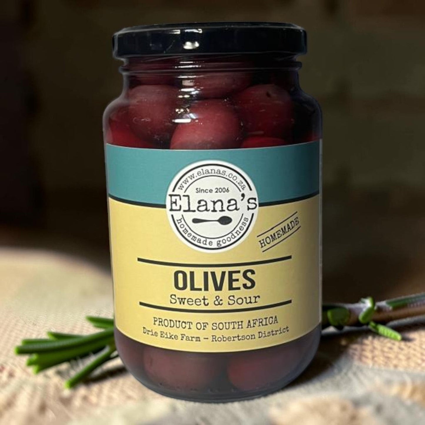 Die Spens Clarens Elana's Sweet & Sour Olives in a glass jar, product of South Africa.