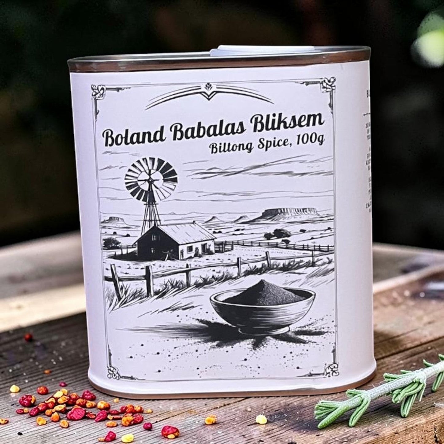 Die Spens Clarens Boland Babalas Bliksem biltong spice tin with a fiery kick, featuring a South African landscape illustration.