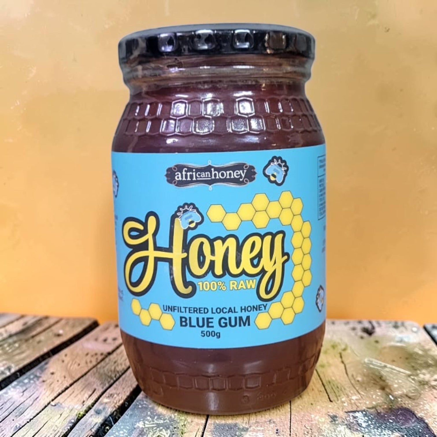 Die Spens Clarens Blue Gum Honey, 500g jar of 100% raw, unfiltered local honey with a deep amber color and a bright blue label.
