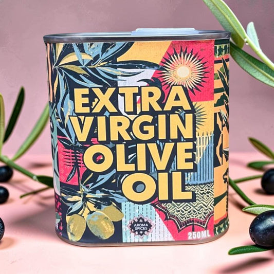 Die Spens Clarens Aroma Spices Extra Virgin Olive Oil in a colourful tin with olive branch and fruit motifs.