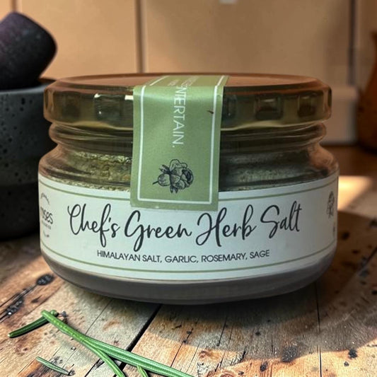 Die Spens Clarens Chef's Green Herb Salt, a blend of Himalayan salt with garlic, rosemary, and sage in a glass jar.