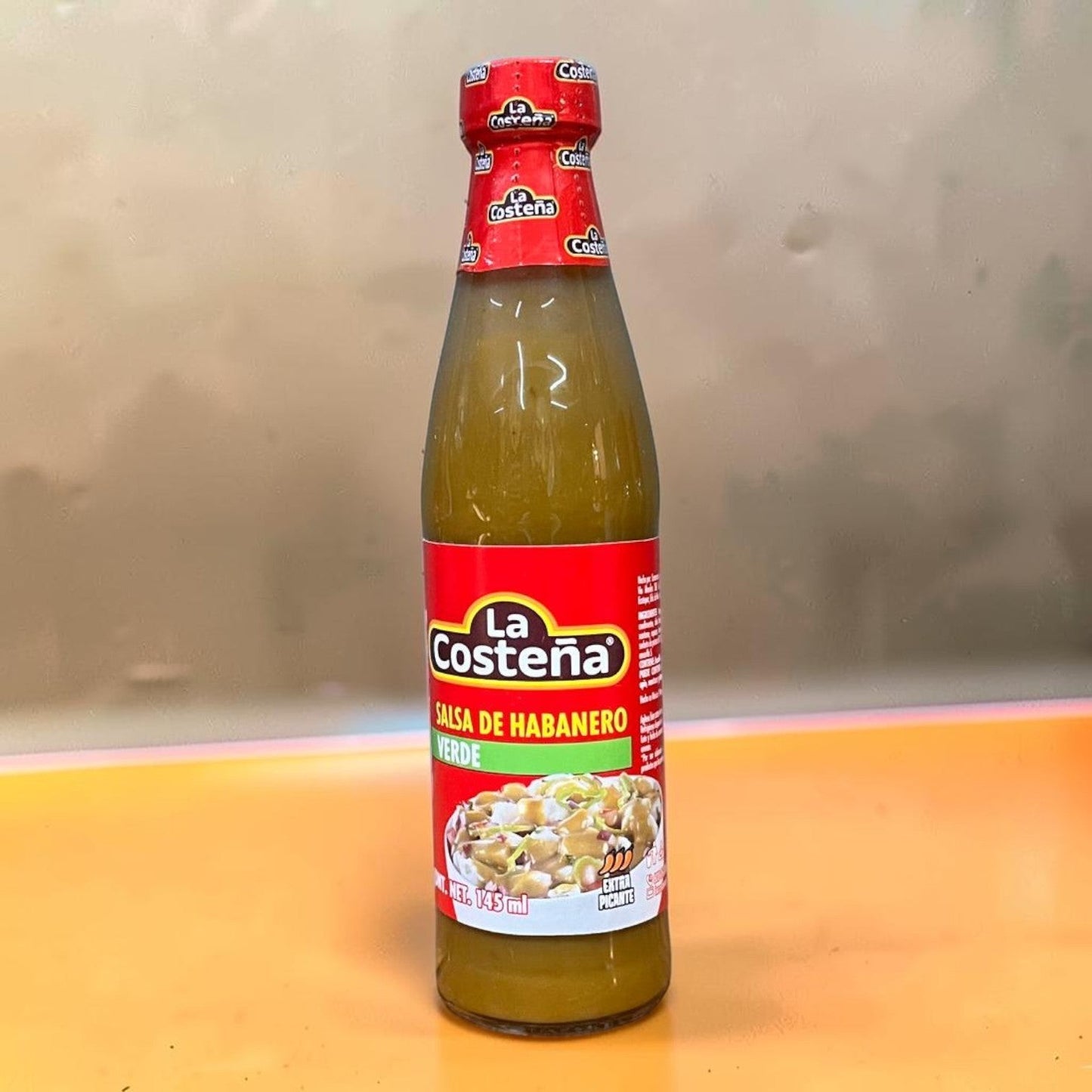 Die Spens Clarens La Costeña Salsa Habanero Verde, a green habanero salsa in a glass bottle with a red label.