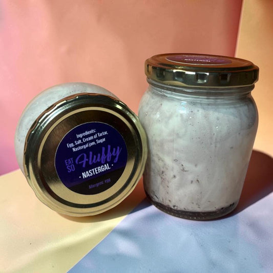 Die Spens Clarens Nastergal Fluffy artisanal spread in a glass jar with a gold lid. Creamy white spread with dark flecks.