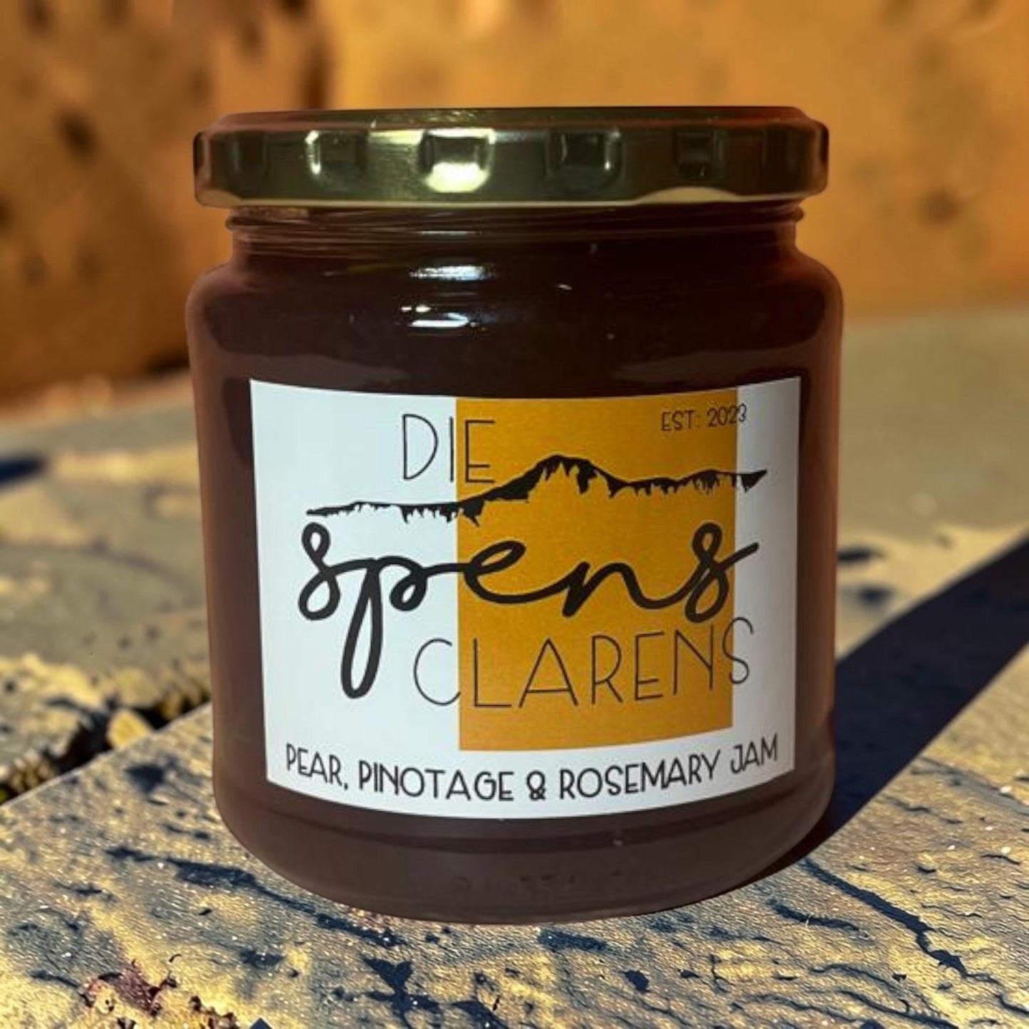 Die Spens Clarens Pear, Pinotage & Rosemary Jam in a glass jar with a gold lid. Unique flavour combination.