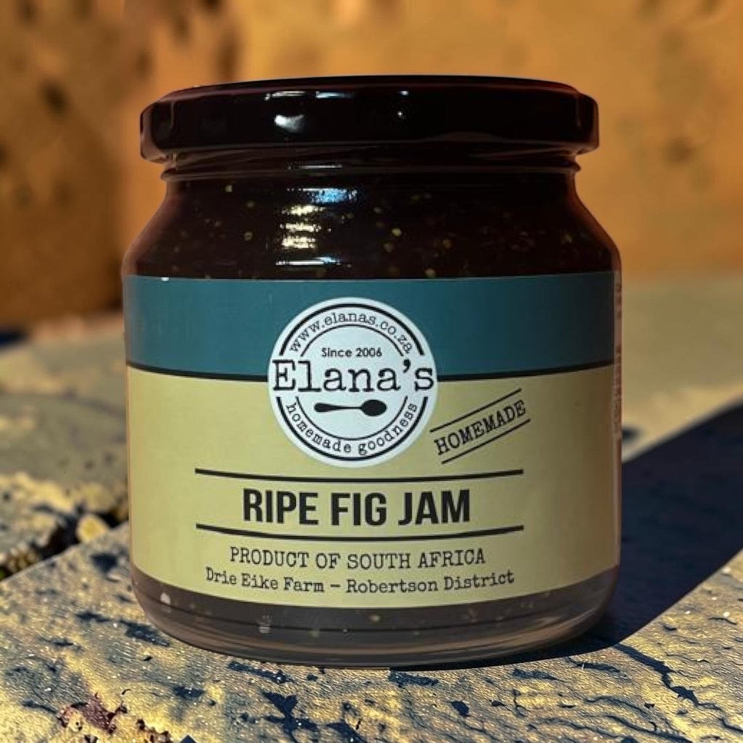 Die Spens Clarens Ripe Fig Jam in a glass jar with a dark lid and a cream and teal label. Homemade goodness from South Africa.