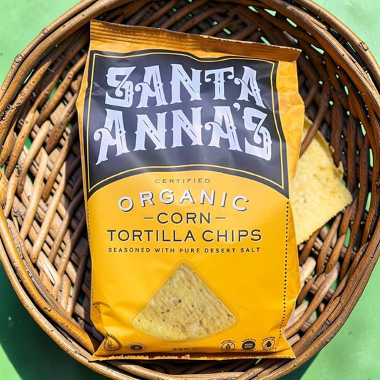 Die Spens Clarens Santa Anna's organic corn tortilla chips in a yellow bag, seasoned with pure desert salt.