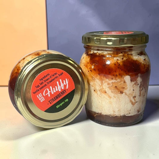 Die Spens Clarens Karoo Blessing Strawberry Fluffy dessert in a jar with strawberry swirls and fluffy texture.