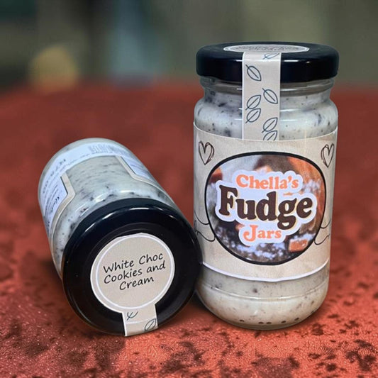 Die Spens Clarens Chella's Fudge Jars in White Chocolate Cookies & Cream flavor in glass jars with black lids.