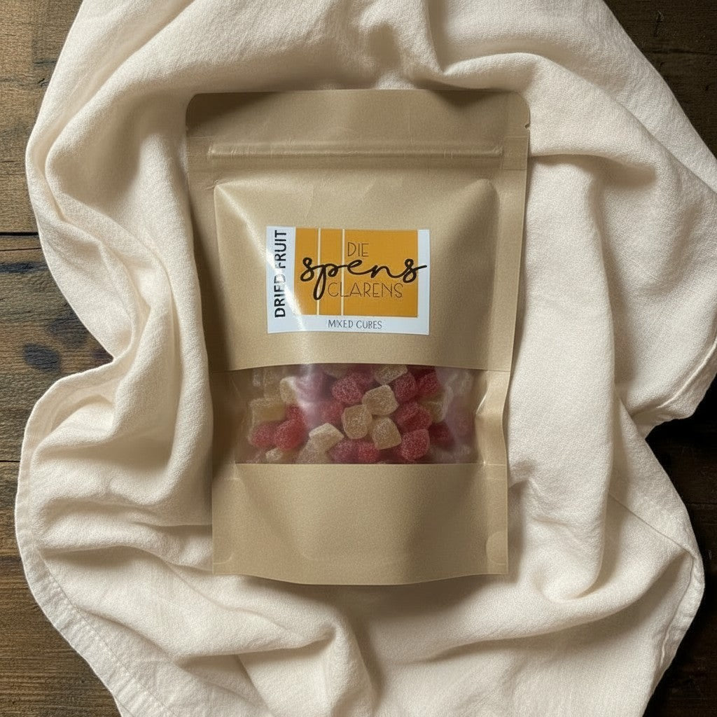 Die Spens Clarens mixed fruit cubes in a resealable pouch, featuring red and light yellow chewy pieces.