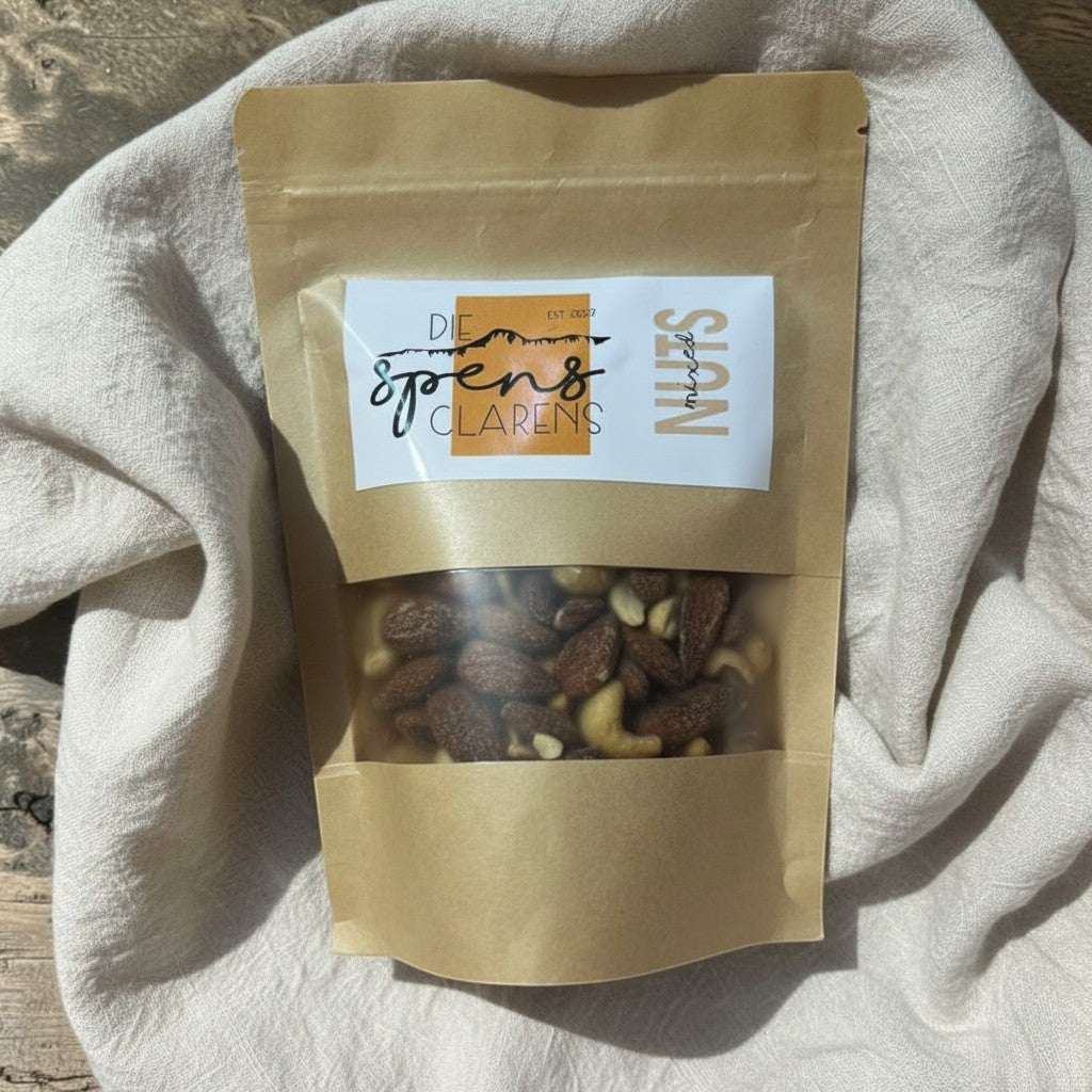 Die Spens Clarens Mixed Nuts in a resealable brown pouch with a clear window showing almonds, cashews, and other nuts.