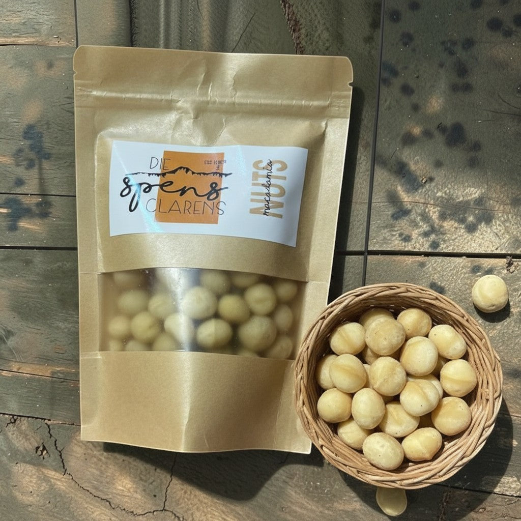 Die Spens Clarens salted macadamia nuts in a brown resealable bag and a small woven basket.