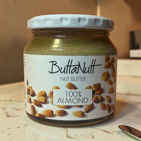 Die Spens Clarens Buttanutt 100% Almond Nut Butter in a glass jar with a white lid. Smooth, creamy almond butter.