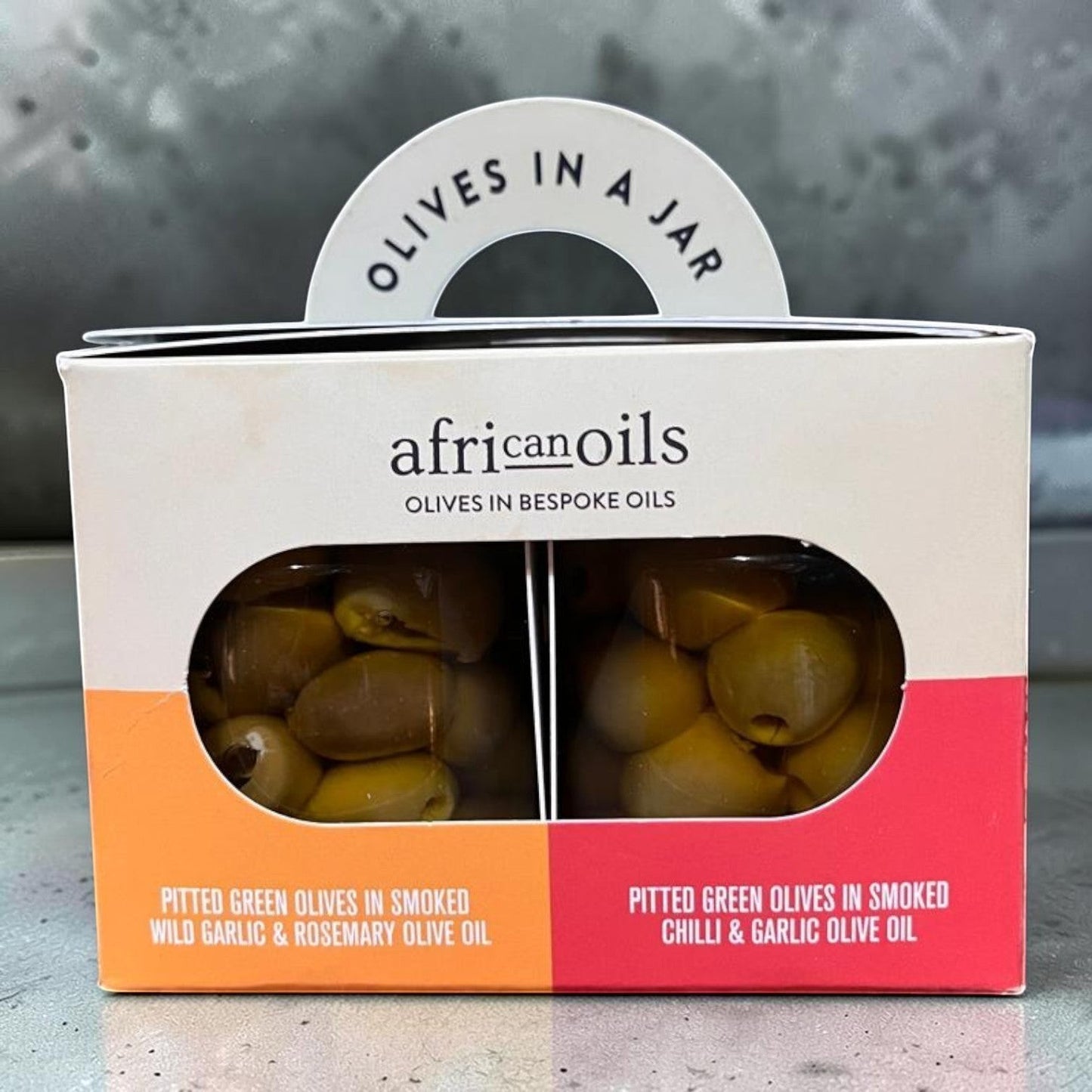 Die Spens Clarens African Oils pitted green olives in two bespoke olive oils: wild garlic & rosemary, and chilli & garlic.