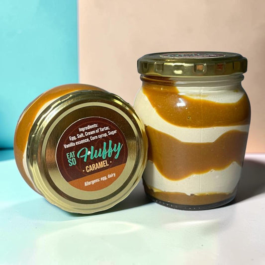 Die Spens Clarens Karoo Blessing Caramel Fluffy spread in a jar with caramel swirls. Made with egg, cream of tartar, vanilla, corn syrup, sugar.