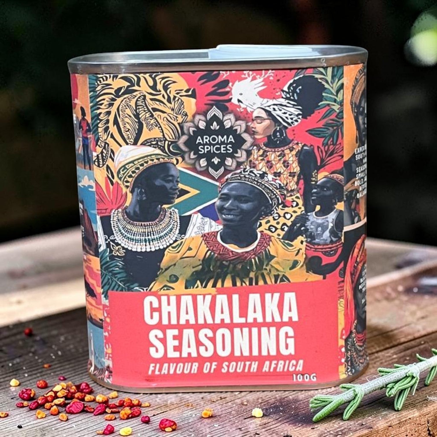 Die Spens Clarens Aroma Spices Chakalaka Seasoning tin with vibrant African art and South African flag motif. 100g.
