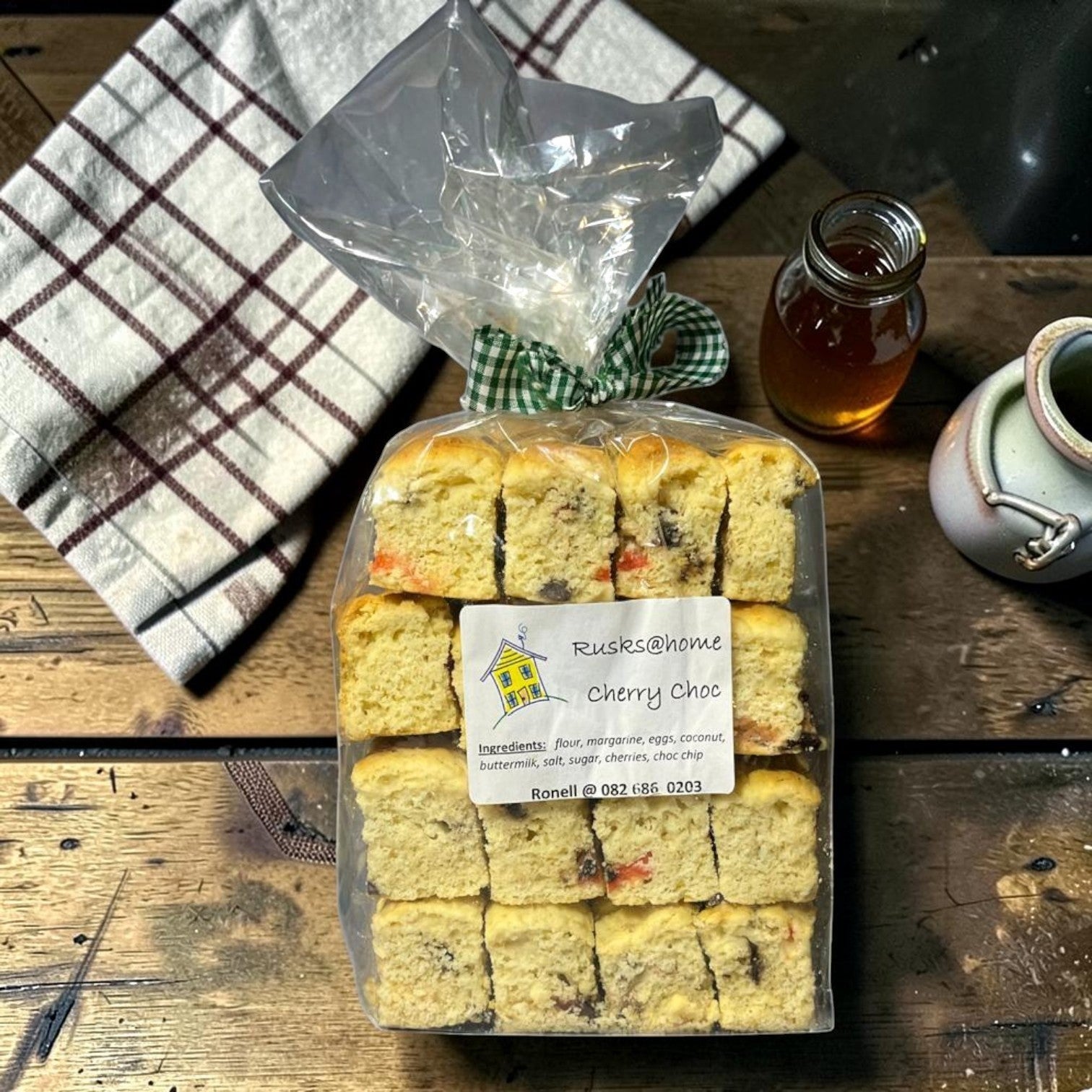 Die Spens Clarens homemade cherry chocolate rusks, baked golden brown with visible pieces of cherry and chocolate chips.