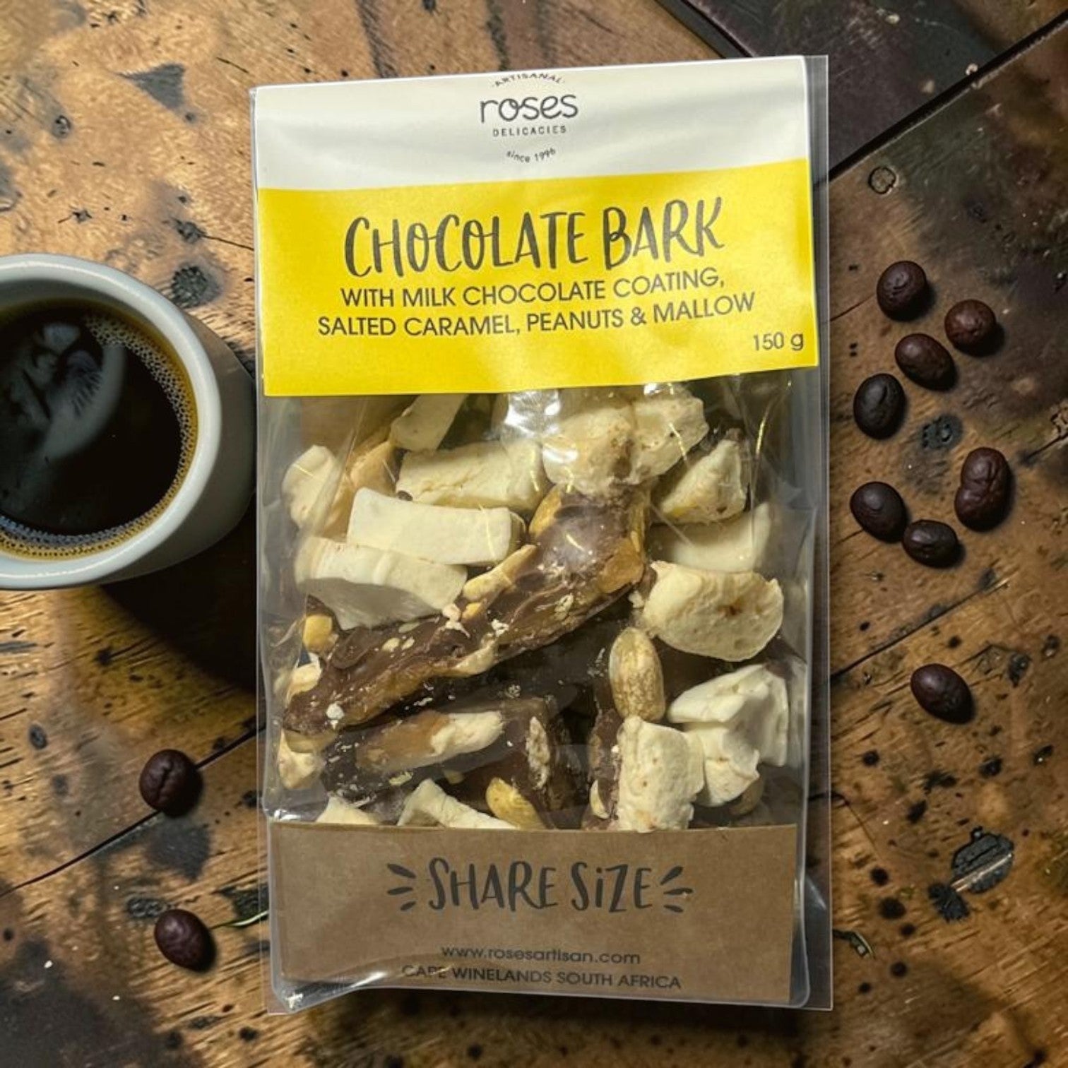 Die Spens Clarens Roses Artisanal Chocolate Bark share bag with milk chocolate, salted caramel, peanuts, and mallow pieces.