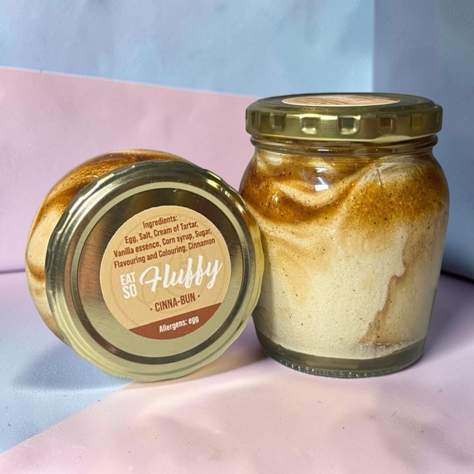 Die Spens Clarens Cinnabun Fluffy dessert in a jar with cinnamon swirls and a fluffy texture.