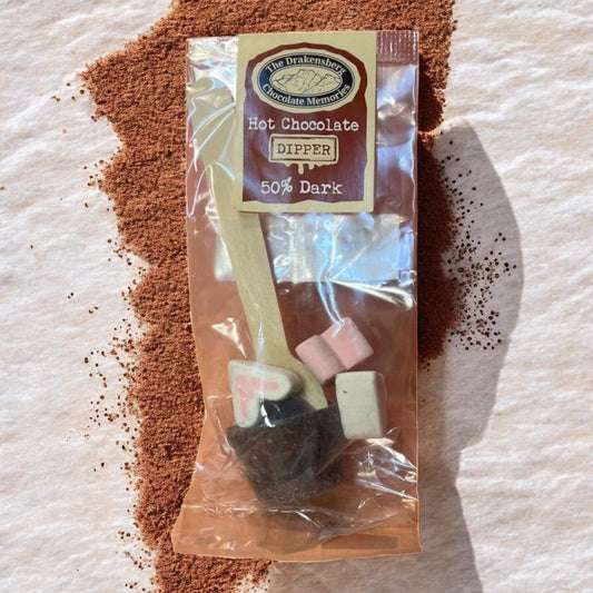 Die Spens Clarens Drakensberg 50% dark chocolate hot chocolate dipper with marshmallows and wooden spoon.