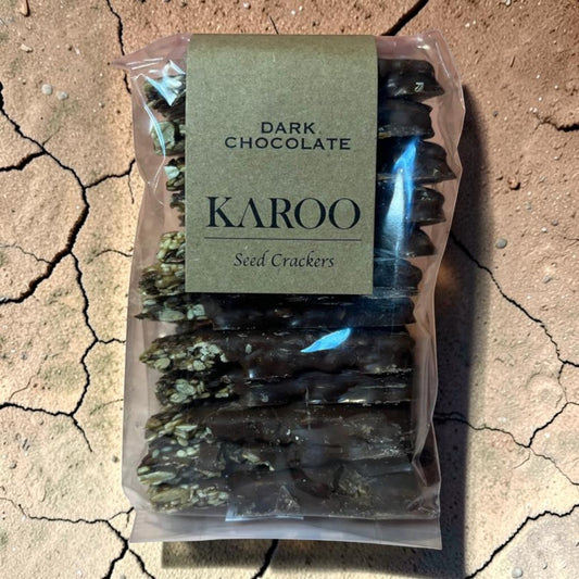 Die Spens Clarens Dark Chocolate Seed Crackers, a stack of seed crackers coated in dark chocolate.