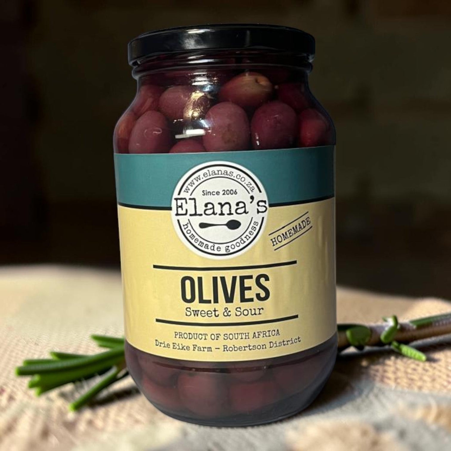 Die Spens Clarens Elana's Sweet & Sour Olives in a glass jar, product of South Africa.
