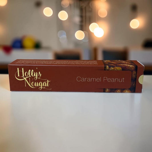Die Spens Clarens Holly's Nougat Caramel Peanut bar with crunchy peanuts and caramel swirls.