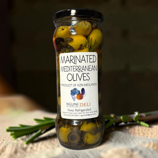 Die Spens Clarens Marinated Mediterranean Olives in a glass jar with herbs and spices.