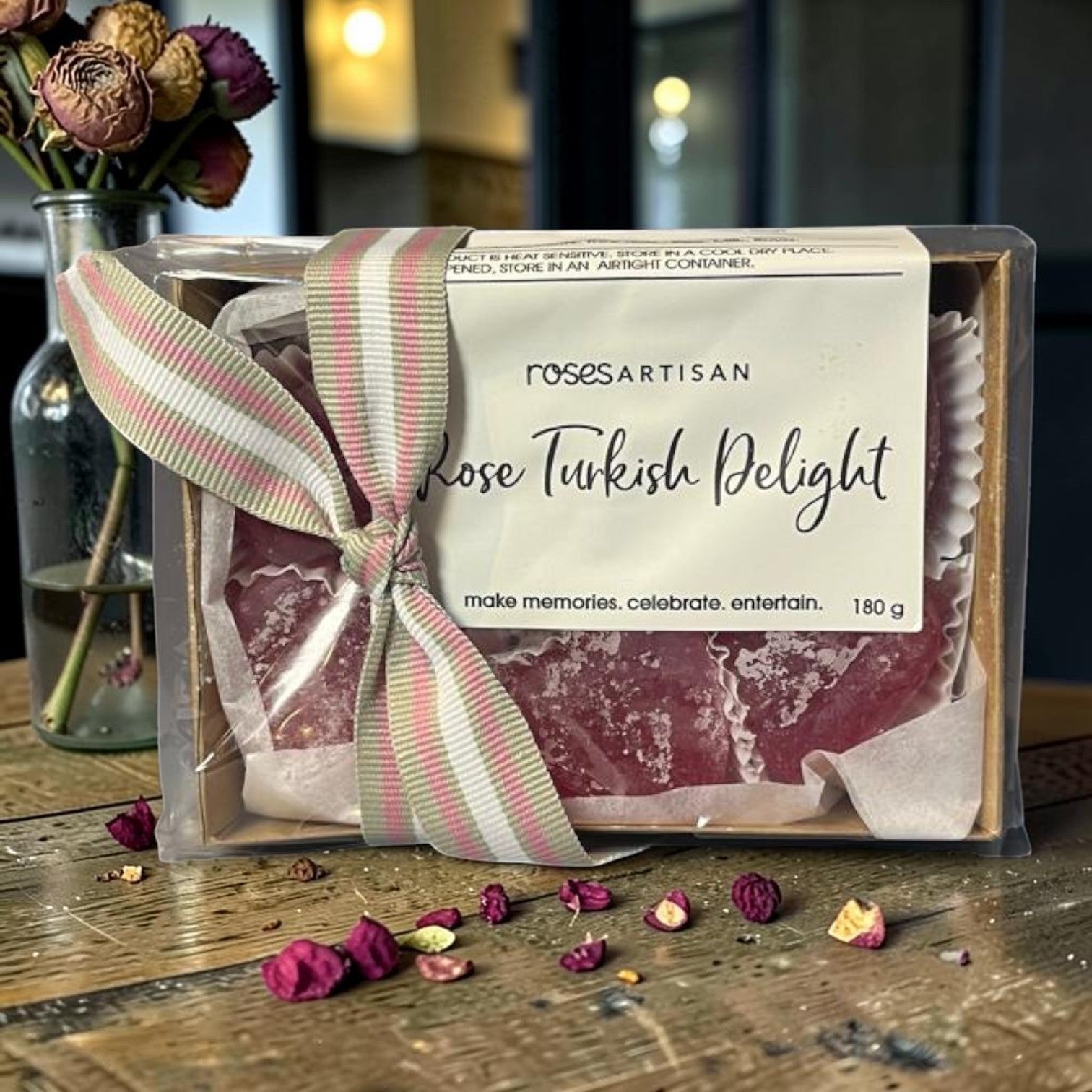 Die Spens Clarens Rose Turkish Delight gift tray with pink and green ribbon, featuring rose-flavoured confectionary dusted with sugar.