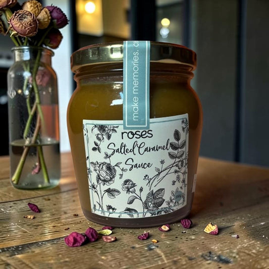 Die Spens Clarens Roses Artisanal Salted Caramel Sauce in a glass jar with a floral label and a blue 'make memories' band.