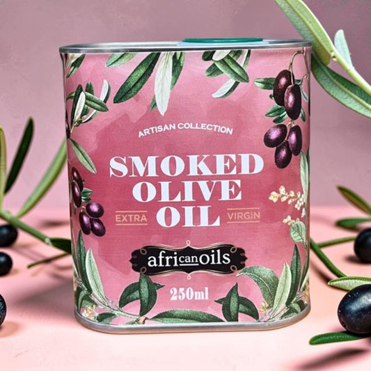 Die Spens Clarens Artisan Collection Smoked Olive Oil, 250ml tin with a pink background and olive branch illustrations.