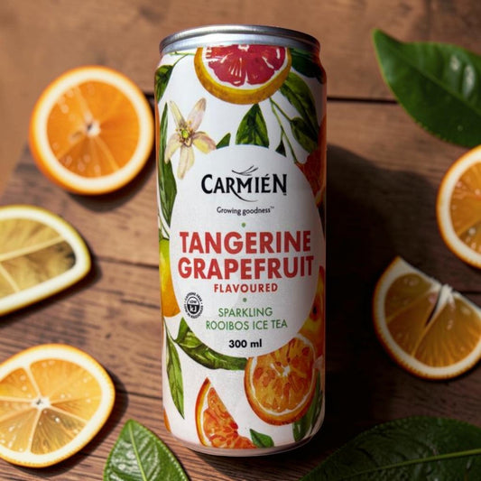 Die Spens Clarens Carmien Tangerine Grapefruit sparkling rooibos ice tea can with citrus slices and leaves.