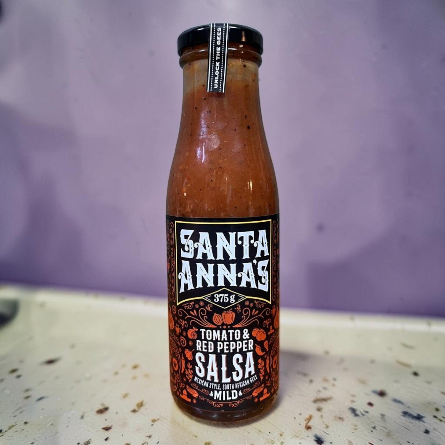 Die Spens Clarens Santa Annas Tomato & Red Pepper Salsa bottle, mild Mexican style with South African flair.