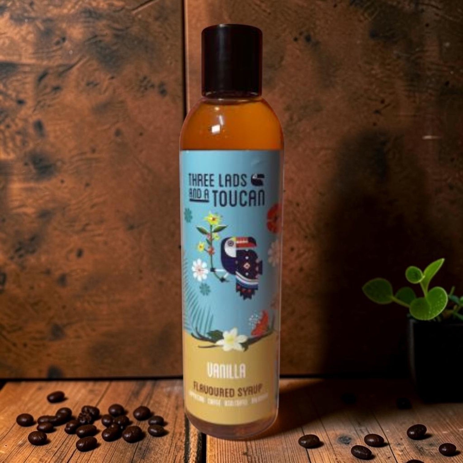 Die Spens Clarens Three Lads and a Toucan vanilla flavoured syrup bottle with toucan and floral design. Perfect for coffee, ice cream, and milkshakes.
