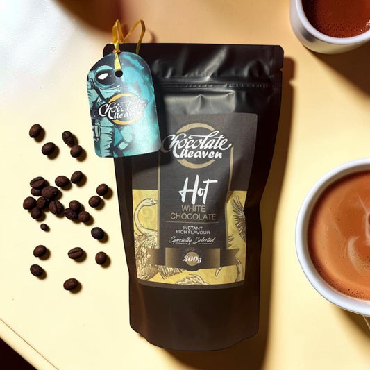 Die Spens Clarens Chocolate Heaven instant white hot chocolate pouch with coffee beans and two cups of hot chocolate.