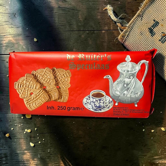 Die Spens Clarens De Ruiter's Reuze Speculaas cookies, windmill-shaped, spiced, 250g pack. Image shows cookies next to a coffee cup and teapot.