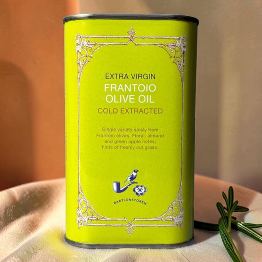 Die Spens Clarens Babylonstoren Frantoio Extra Virgin Olive Oil in a bright green tin with ornate gold detailing. Cold extracted with floral, almond, and green apple notes.