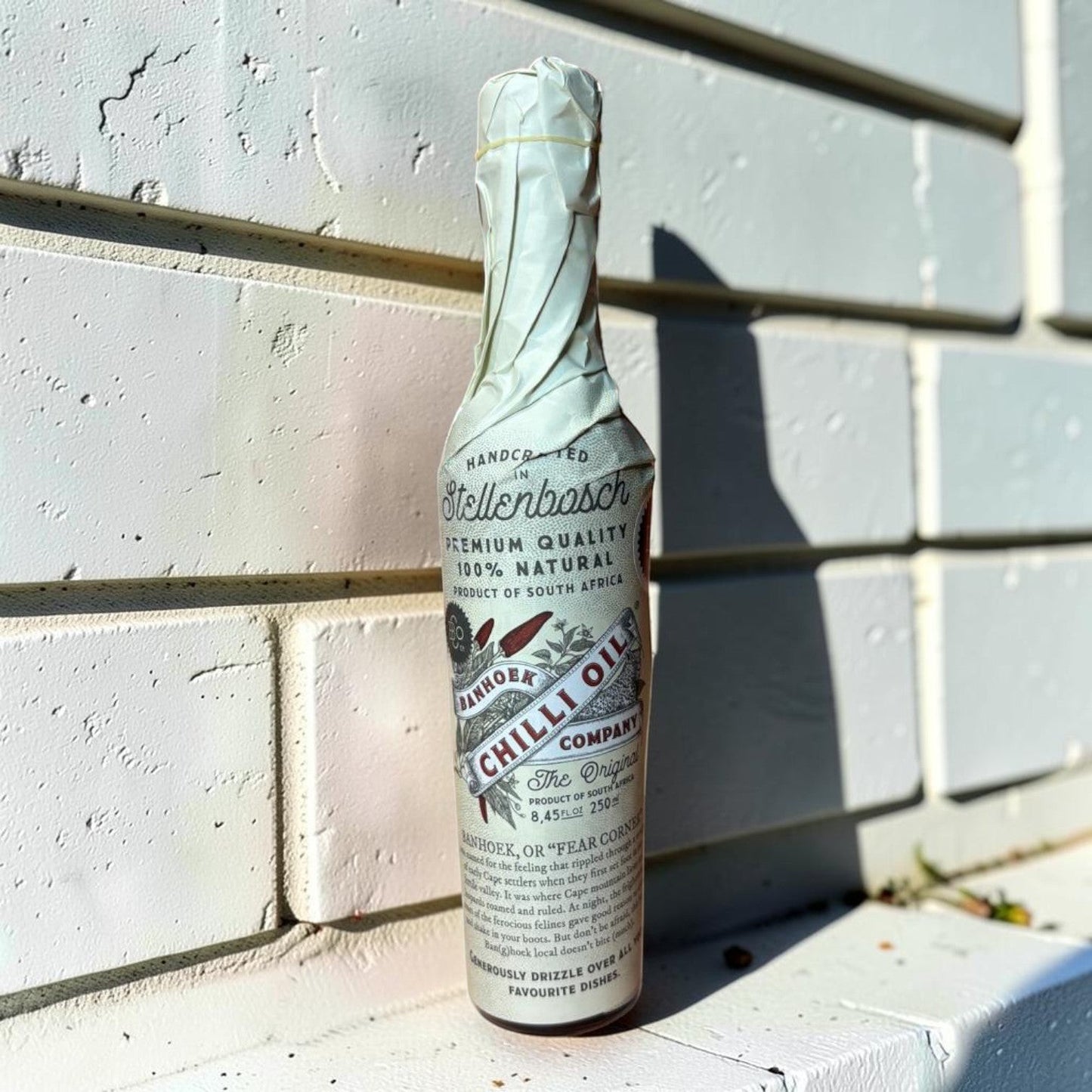 Die Spens Clarens Banhoek Chilli Oil bottle, handcrafted in Stellenbosch, South Africa. 100% natural premium quality condiment.