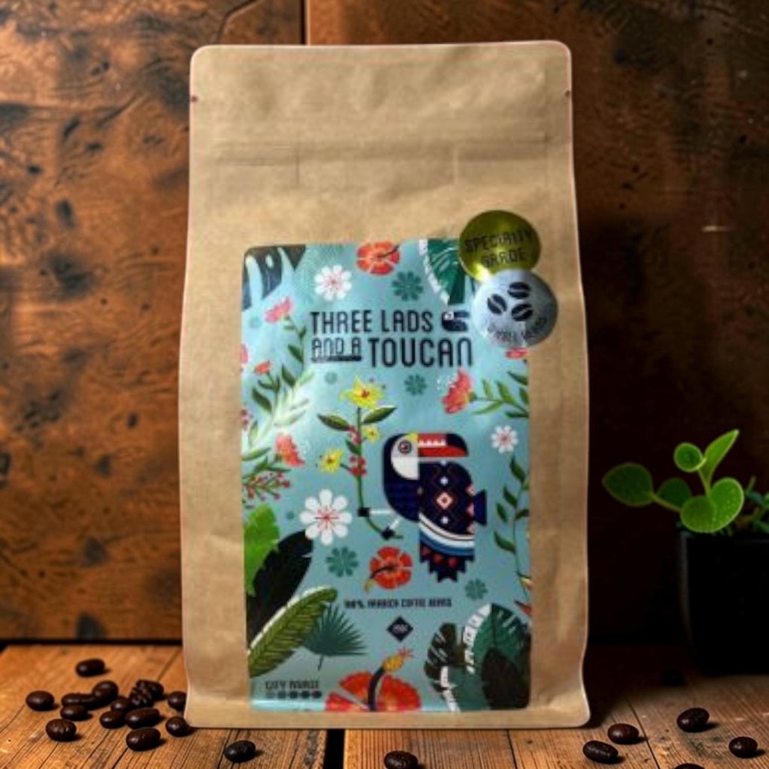 Die Spens Clarens Three Lads and a Toucan City Roast 100% Arabica coffee beans with vibrant tropical design.