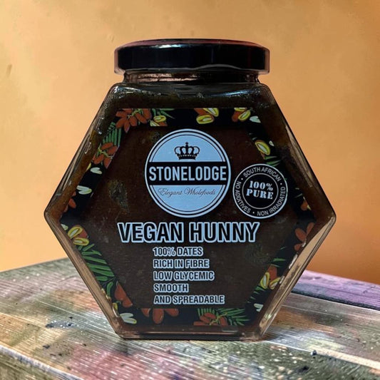 Die Spens Clarens Stonelodge Vegan Hunny in a hexagonal jar, made from 100% dates, rich in fibre, low glycemic, smooth and spreadable.